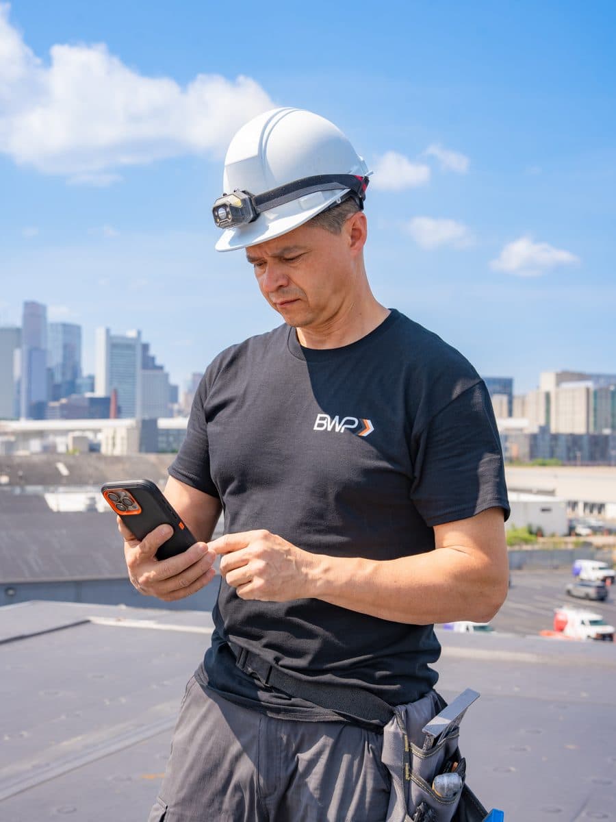 Business owner and contractor managing jobs, invoices, and operations on mobile